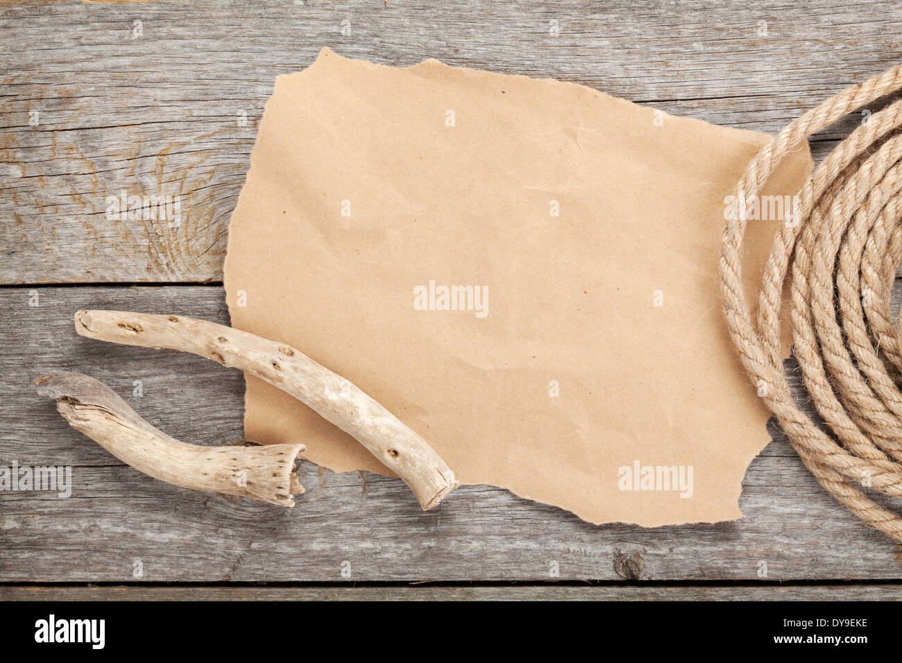 Old paper for copy space and rope on wooden textured background Stock Photo