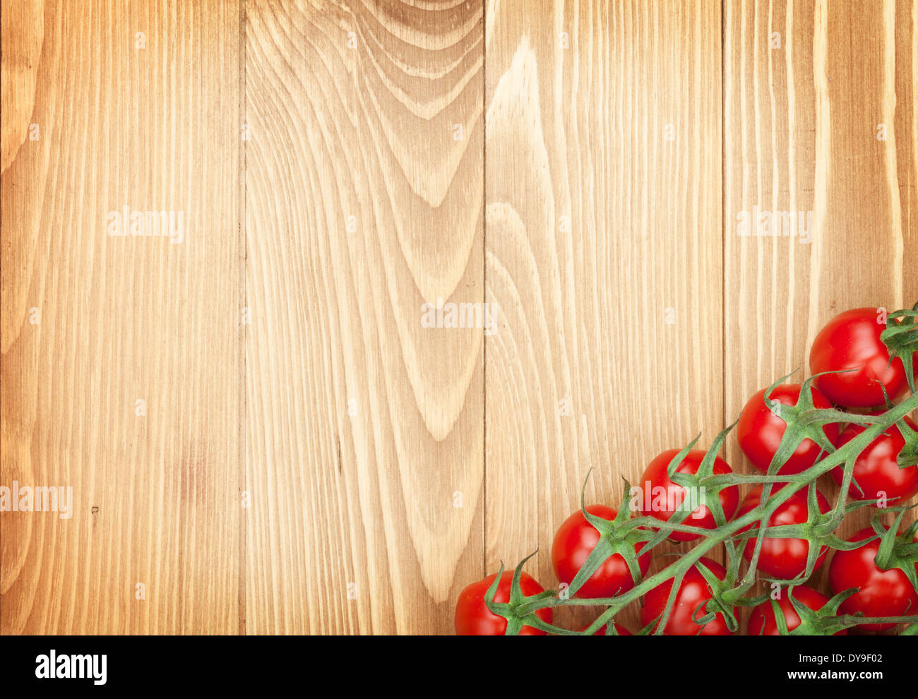 Cherry tomatoes on wooden table background with copy space Stock Photo ...