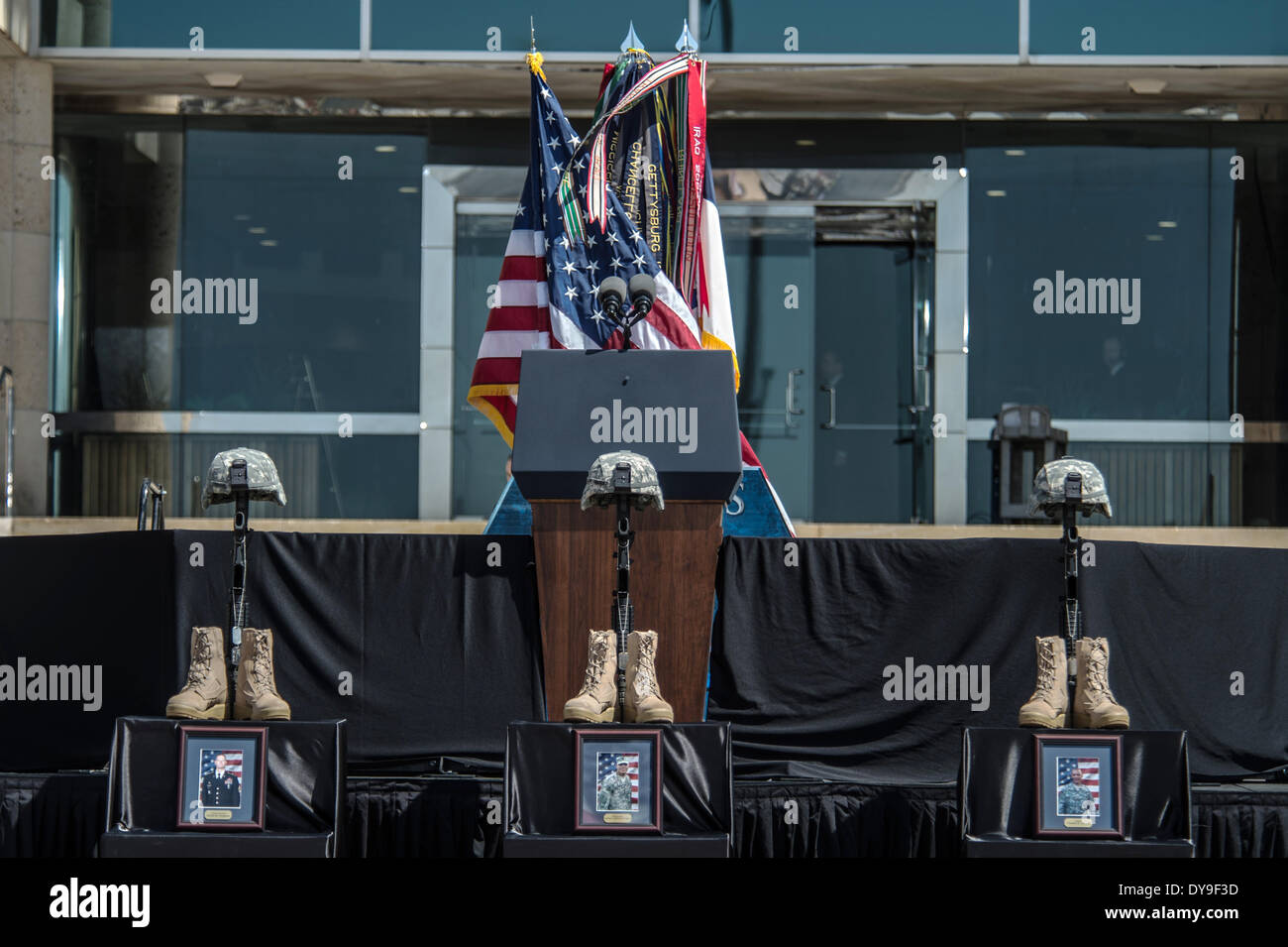 A  Battlefield Cross of boots, helmet and rifle for fallen soldiers during a memorial ceremony for the three soldiers killed and 16 injured in a gun rampage by a fellow soldier April 9, 2014 in Fort Hood, Texas. Credit:  Planetpix/Alamy Live News Stock Photo