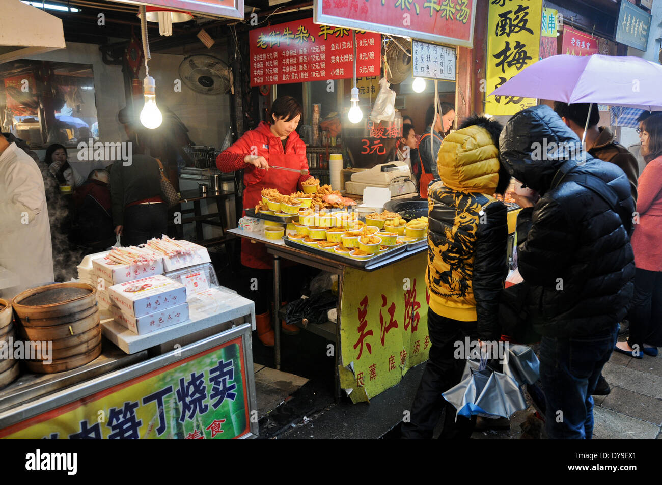 people buying food on a bazaar in Shanghai, China Stock Photo