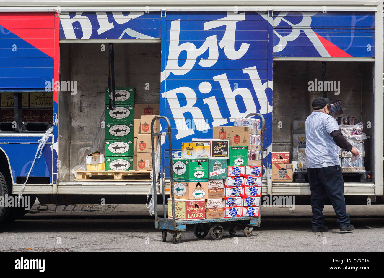 A beer distributor makes a delivery in a Pabst Blue Ribbon branded