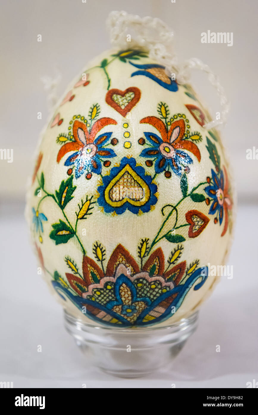 Easter egg decorated with flowers made by decoupage technique on light ...