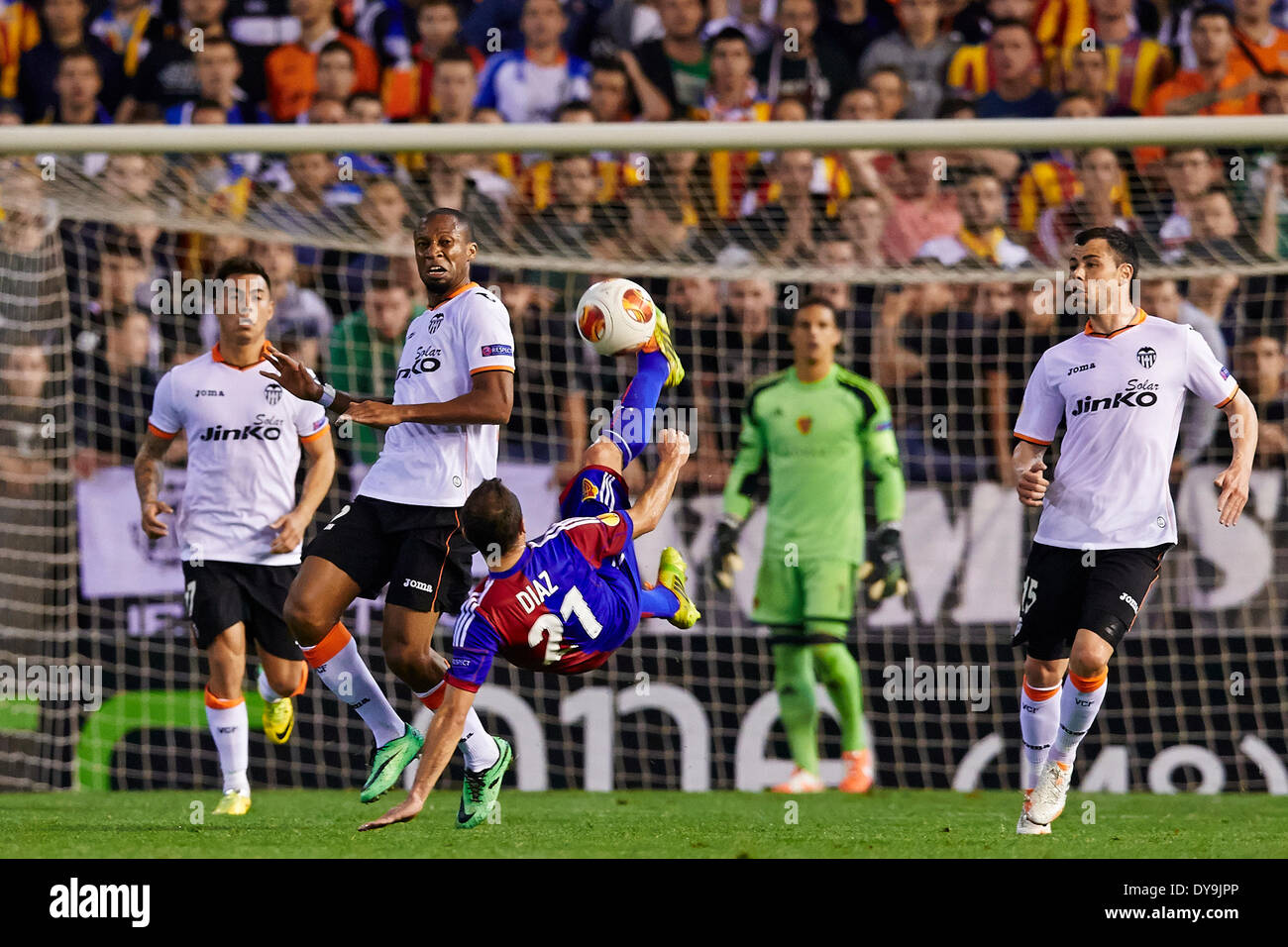 Valencia, Spain. 10th Apr, 2014. Midfielder Marcelo Diaz of FC Basel (3rd L) clears the ball away with an overhead kick during the Europa League Game between Valencia CF and FC Basel at Mestalla Stadium, Valencia Credit:  Action Plus Sports/Alamy Live News Stock Photo
