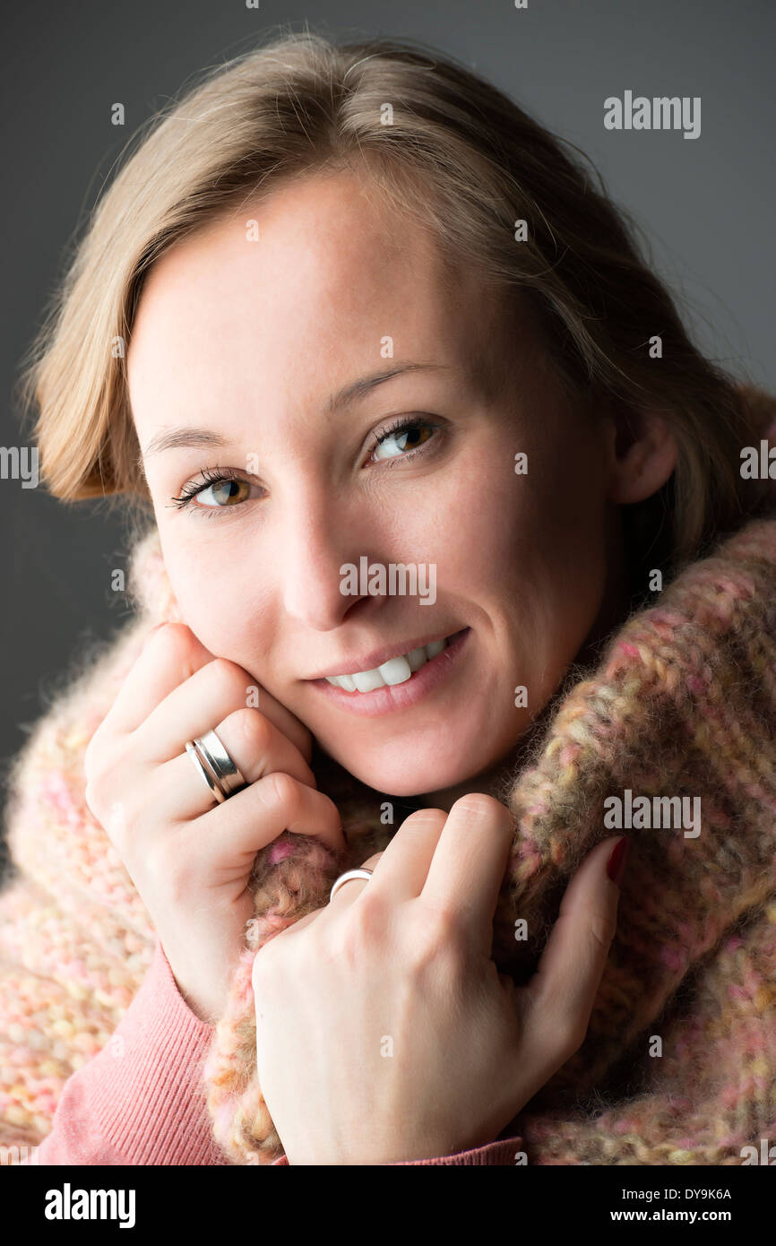 Portrait of a young woman with wool scarf Stock Photo