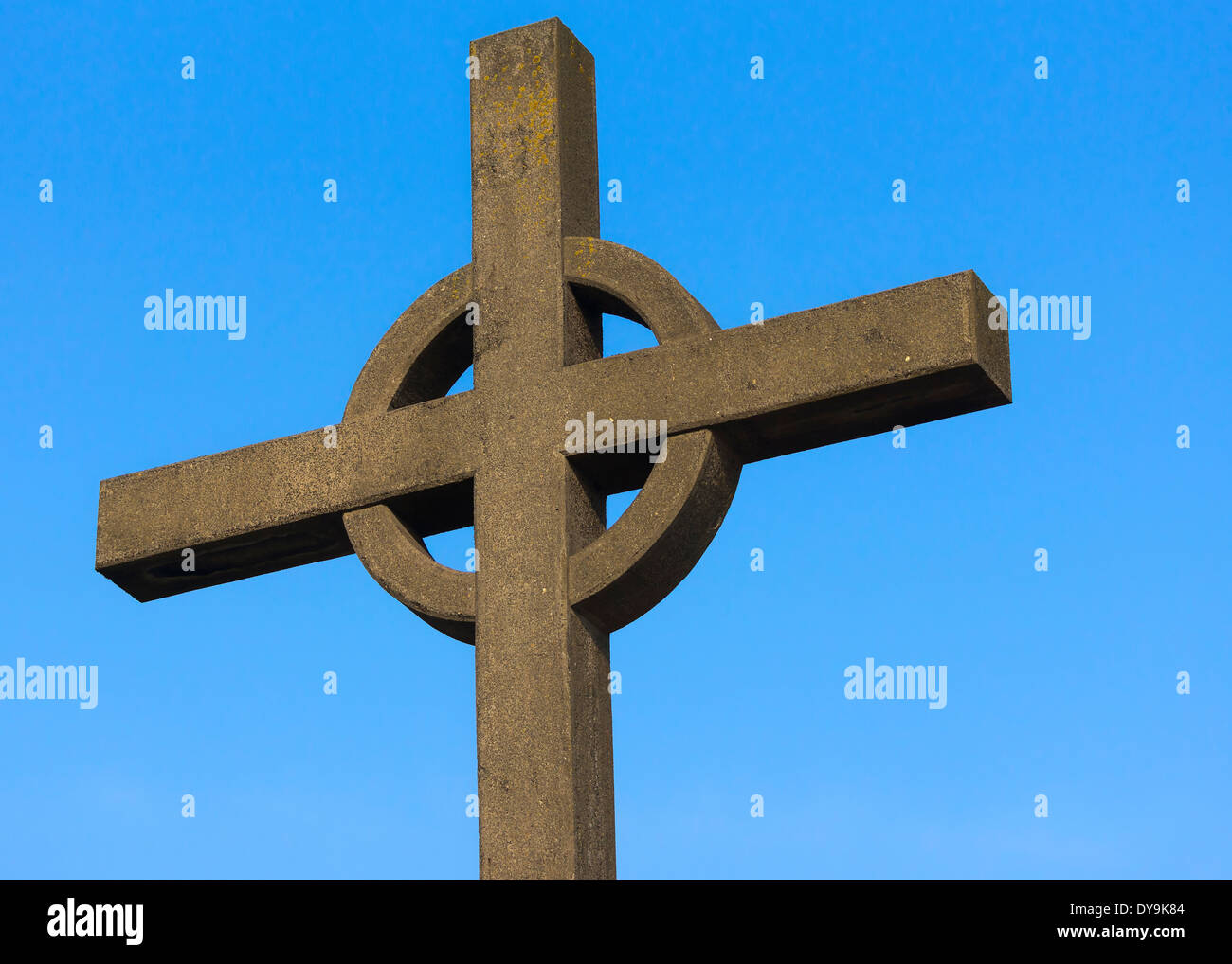 Top of Irish cross against blue sky. Stock Photo
