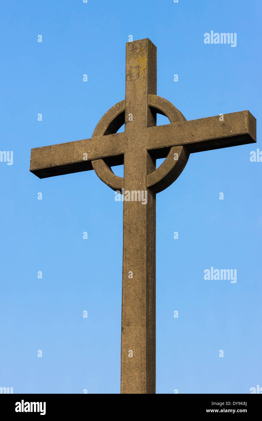 Irish cross against blue sky. Stock Photo