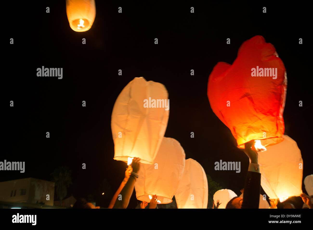 Releasing flying candles, paper balloons with hot air to freely flow  through the sky until the candle goes out Stock Photo - Alamy