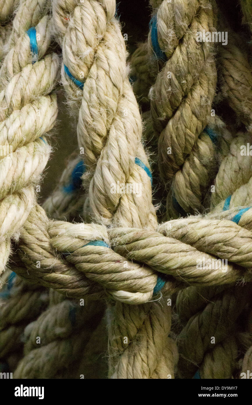 Weather rope with blue fleck twisted and looped. Stock Photo