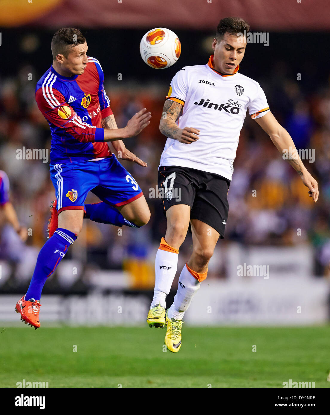 Valencia, Spain. 10th Apr, 2014. Defender Taulant Xhaka of FC Basel (L) duels for a high ball with Midfielder Eduardo Vargas of Valencia CF during the Europa League Game between Valencia CF and FC Basel at Mestalla Stadium, Valencia Credit:  Action Plus Sports/Alamy Live News Stock Photo