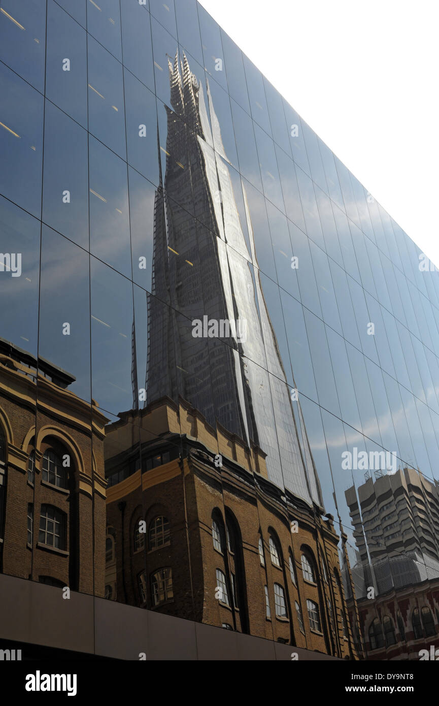 London, UK. 10 April 2014, Reflection of Shard in 6 More London Place building on a sunny day in the capital. Credit:  JOHNNY ARMSTEAD/Alamy Live News Stock Photo