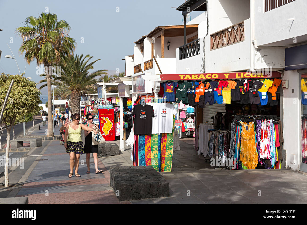 Sea front shops and people walking, Puerto Carmen, Lanzarote, Canary Islands, Spain Stock Photo