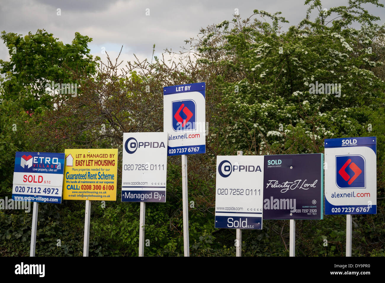 Estate agents boards advertising sales or rentals seen in south east London, UK. Stock Photo
