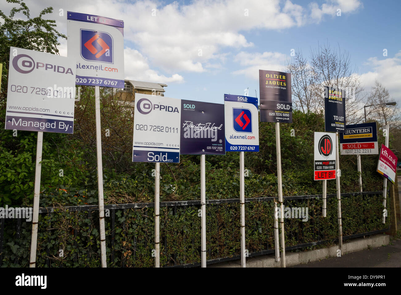 Estate agents boards advertising sales or rentals seen in south east London, UK. Stock Photo