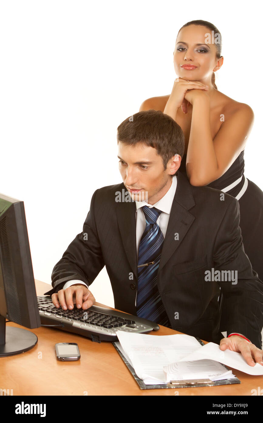 Two contemporary businesspeople discussing while working at the computer Isolated on white background Stock Photo