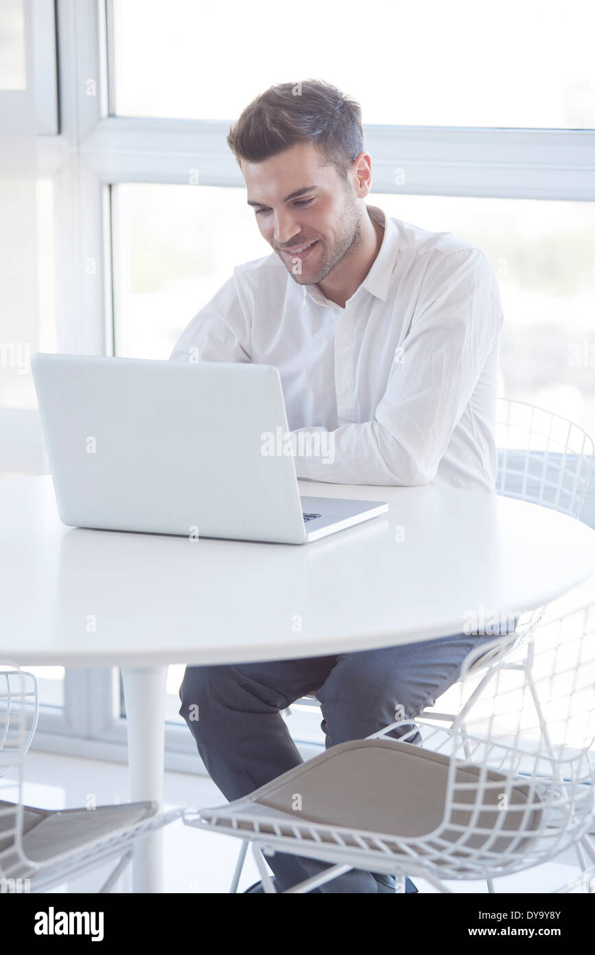 Man using laptop computer Stock Photo - Alamy