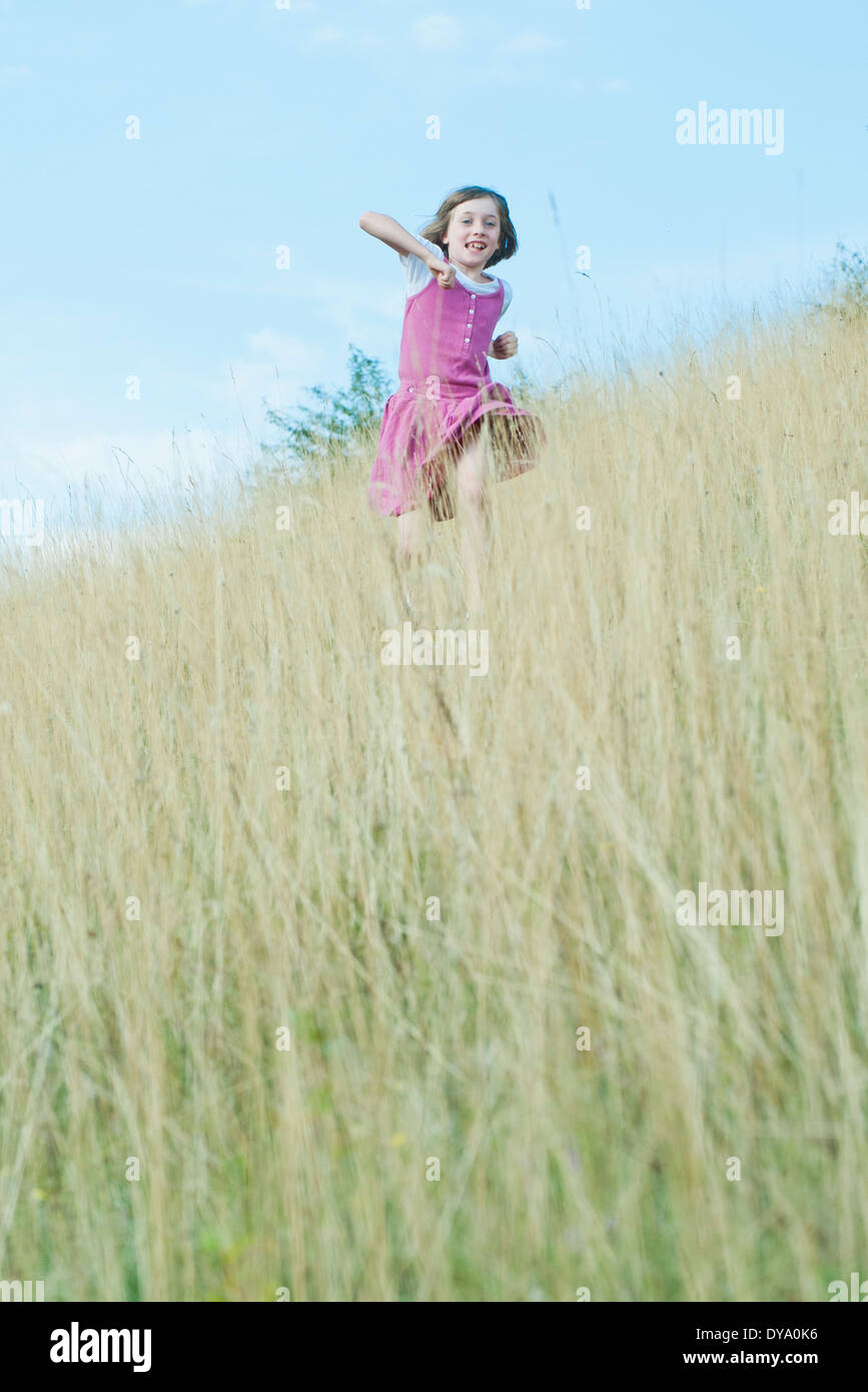 Girl running through tall grass hires stock photography and images Alamy