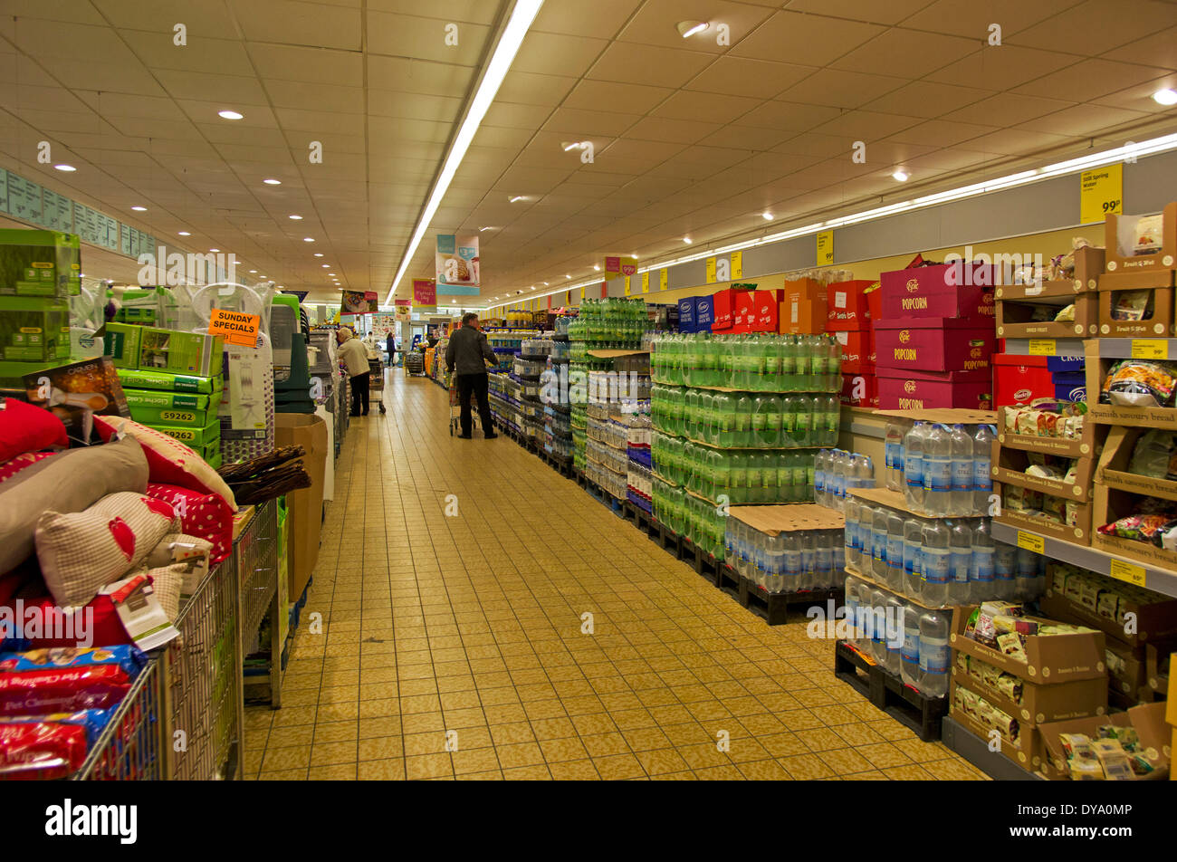 Isles of Aldi with pallets of soft drinks and their central area of odds and ends specials Stock
