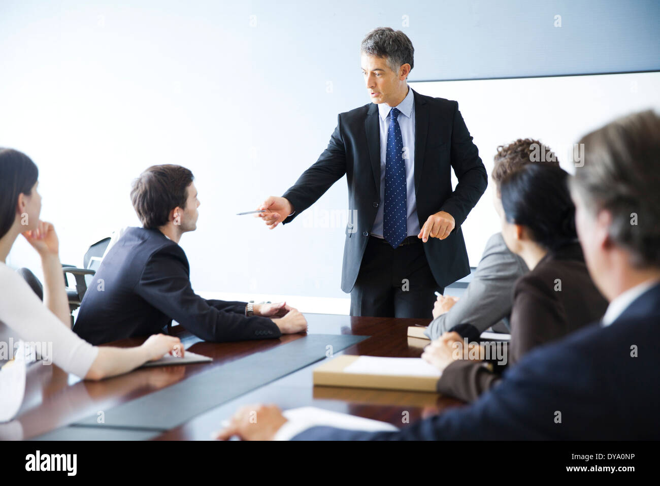 Business executive giving presentation at meeting Stock Photo Alamy