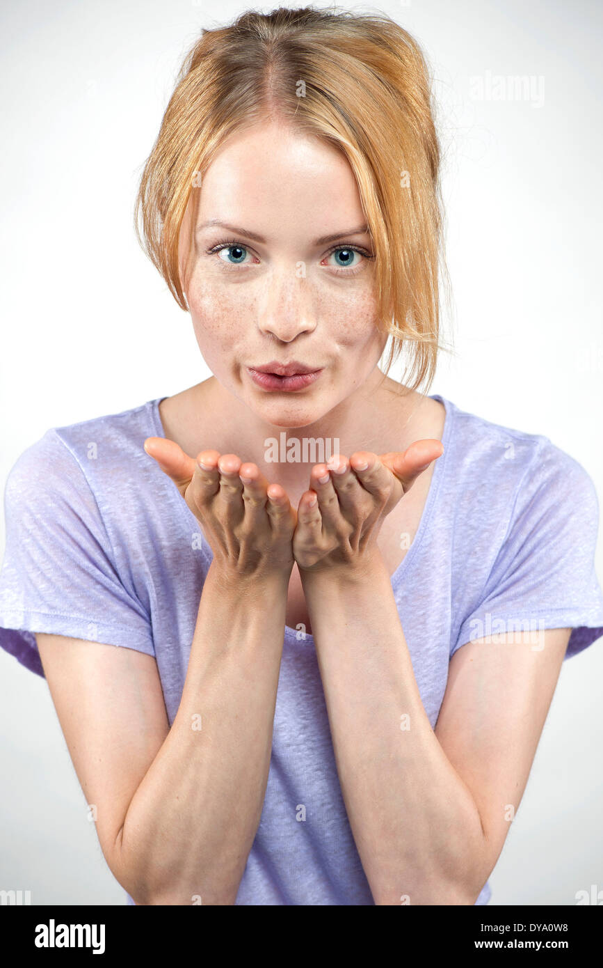 Young woman blowing a kiss Stock Photo