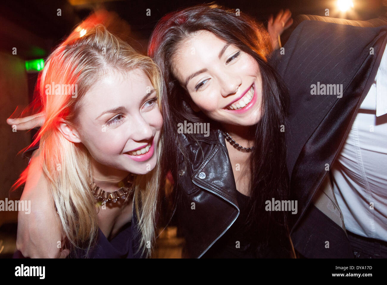 Friends out at night having fun Stock Photo