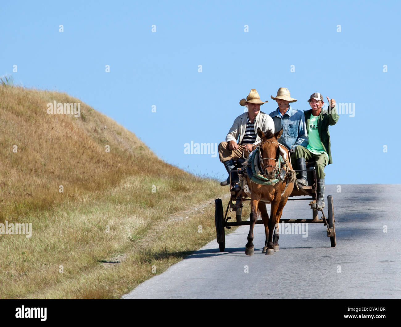 Three men travelling in horse drawn cart Sancti Spiritus Province Cuba Stock Photo