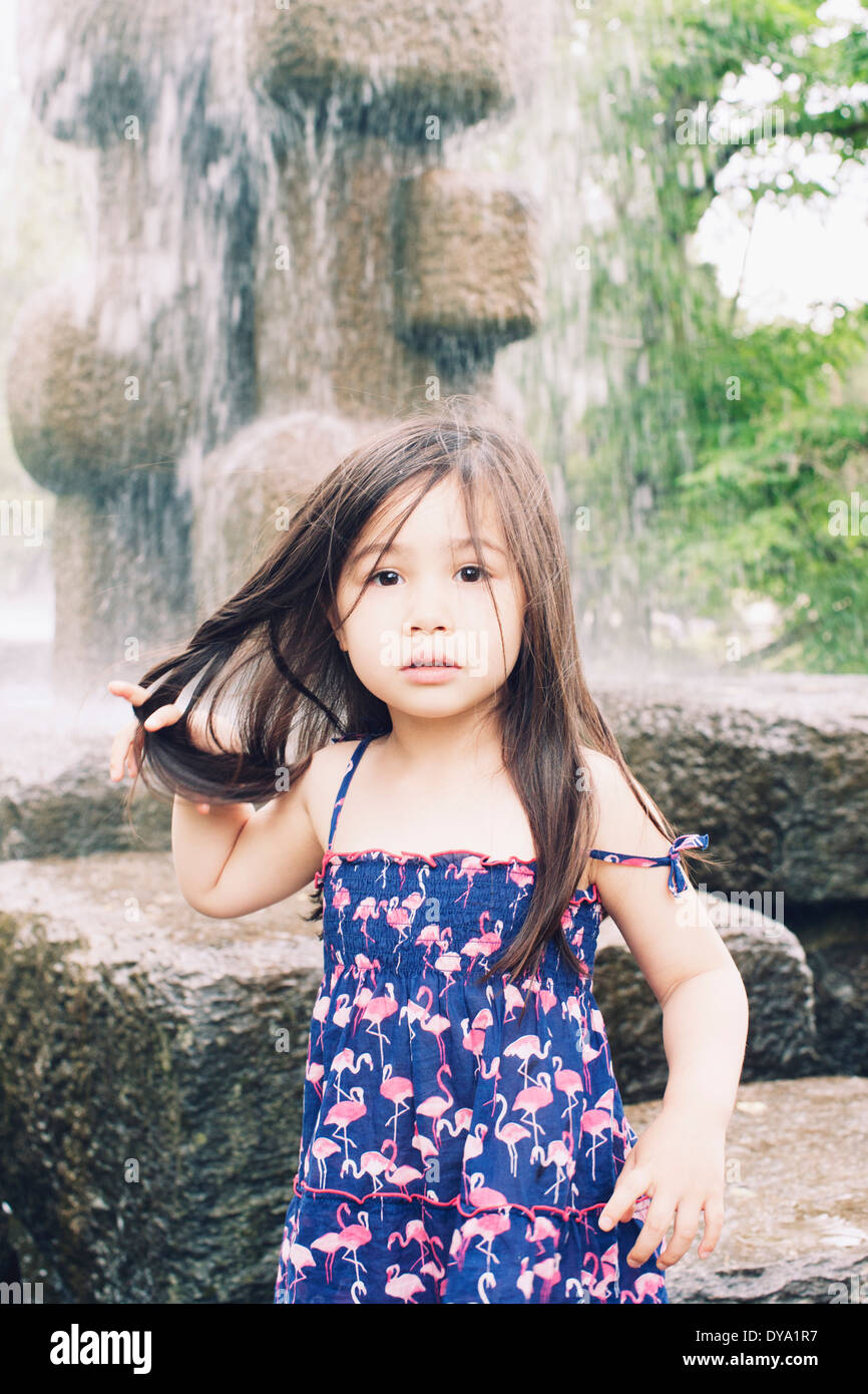 Little girl by water fountain, portrait Stock Photo