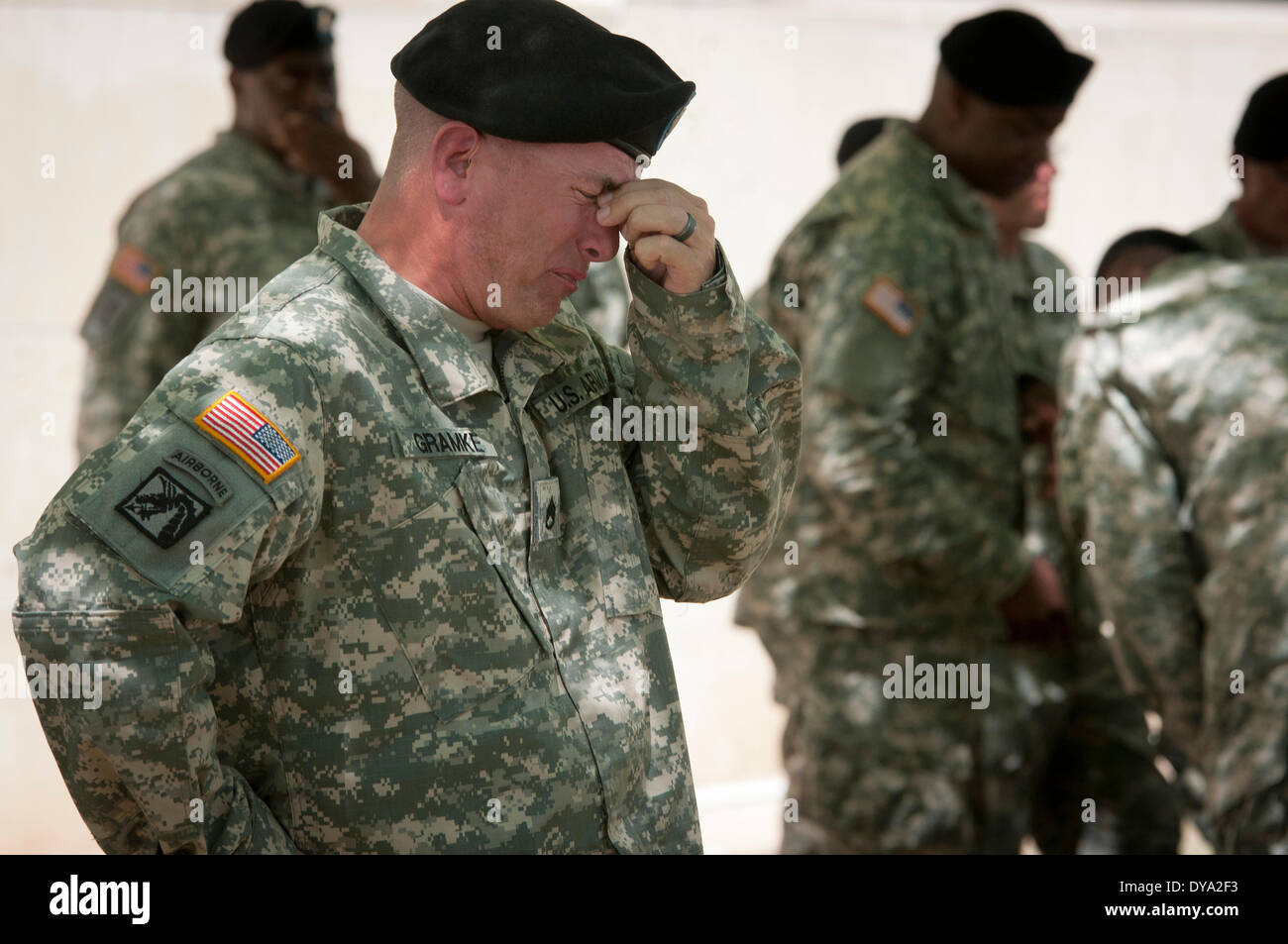 Staff Sgt. Jerry Gramke breaks down during the memorial service for the soldiers killed in a shooting rampage at Fort Hood April 9, 2014 in Fort Hood, Texas. All three Soldiers were killed in the April 2 shooting by a fellow soldier. Stock Photo