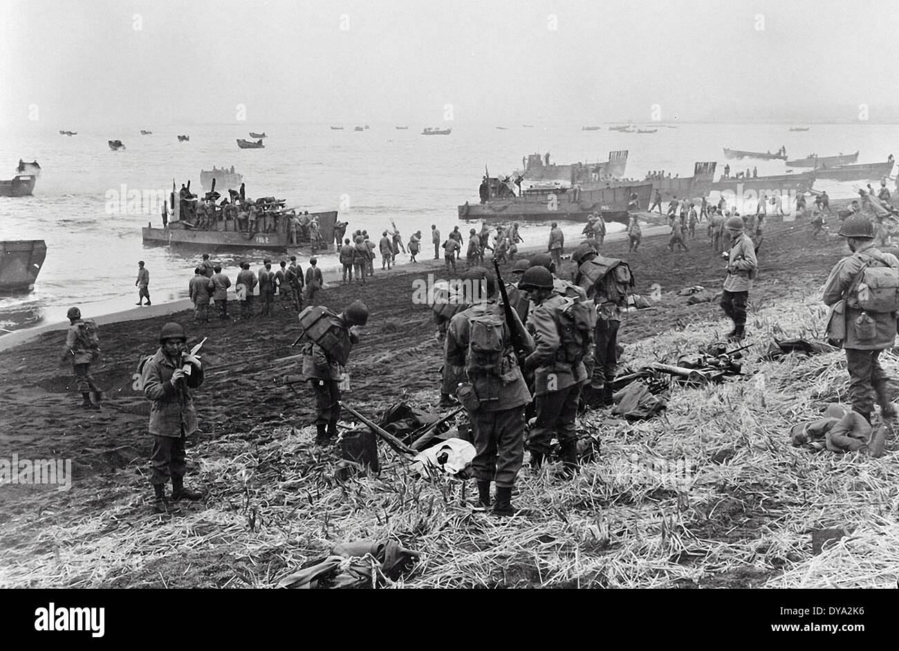 WW II historical war world war second world war Aleutian Islands landing crafts soldiers military equipment beach seashore Mas Stock Photo