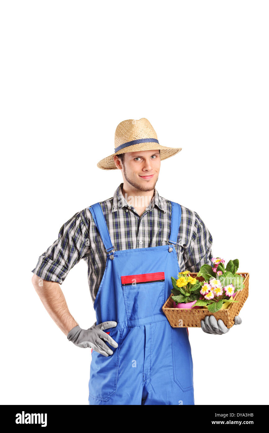Male gardener holding a basket with flowers Stock Photo