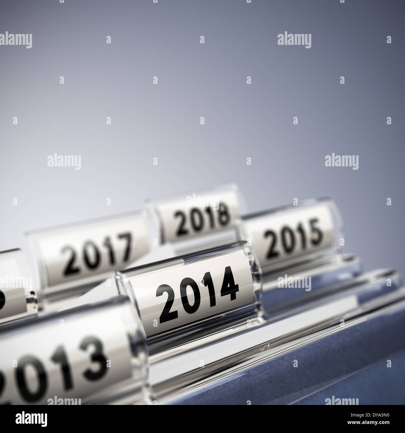 Folder tab with focus on 2014, blue background. Taxes concept for illustration of mid-term or long-term business strategy. Stock Photo