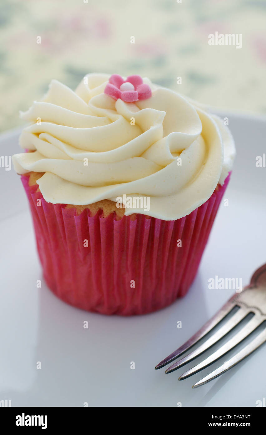 Cupcake with swirled vanilla buttercream frosting Stock Photo