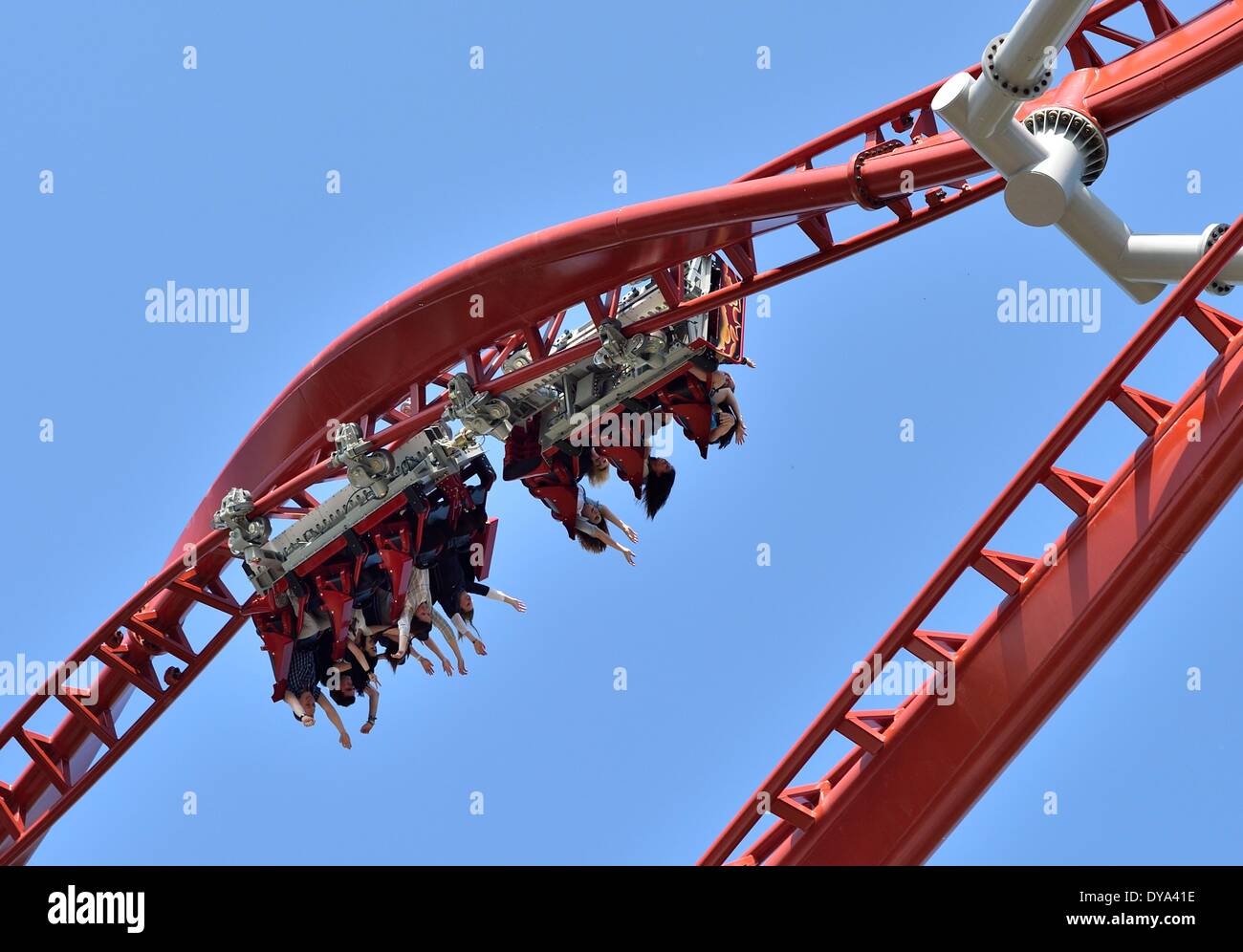 Hassloch, Germany. 11th Apr, 2014. Visitors ride the new roller coaster  'Sky Screamer' in the Holiday Park in Hassloch, Germany, 11 April 2014. The roller  coaster cost eight million euros and is
