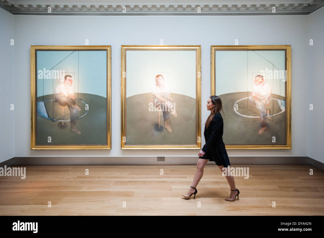 London, UK - 11 April 2014: a Christie’s employee looks at Three ...