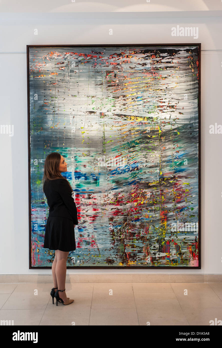 London, UK - 11 April 2014: a Christie’s employee looks at Abstraktes Bild (712), 1990 by Gerhard Richter during the preview of the Post-War and Contemporary Art evening sale that will take place in New York on the 13th May. Credit:  Piero Cruciatti/Alamy Live News Stock Photo