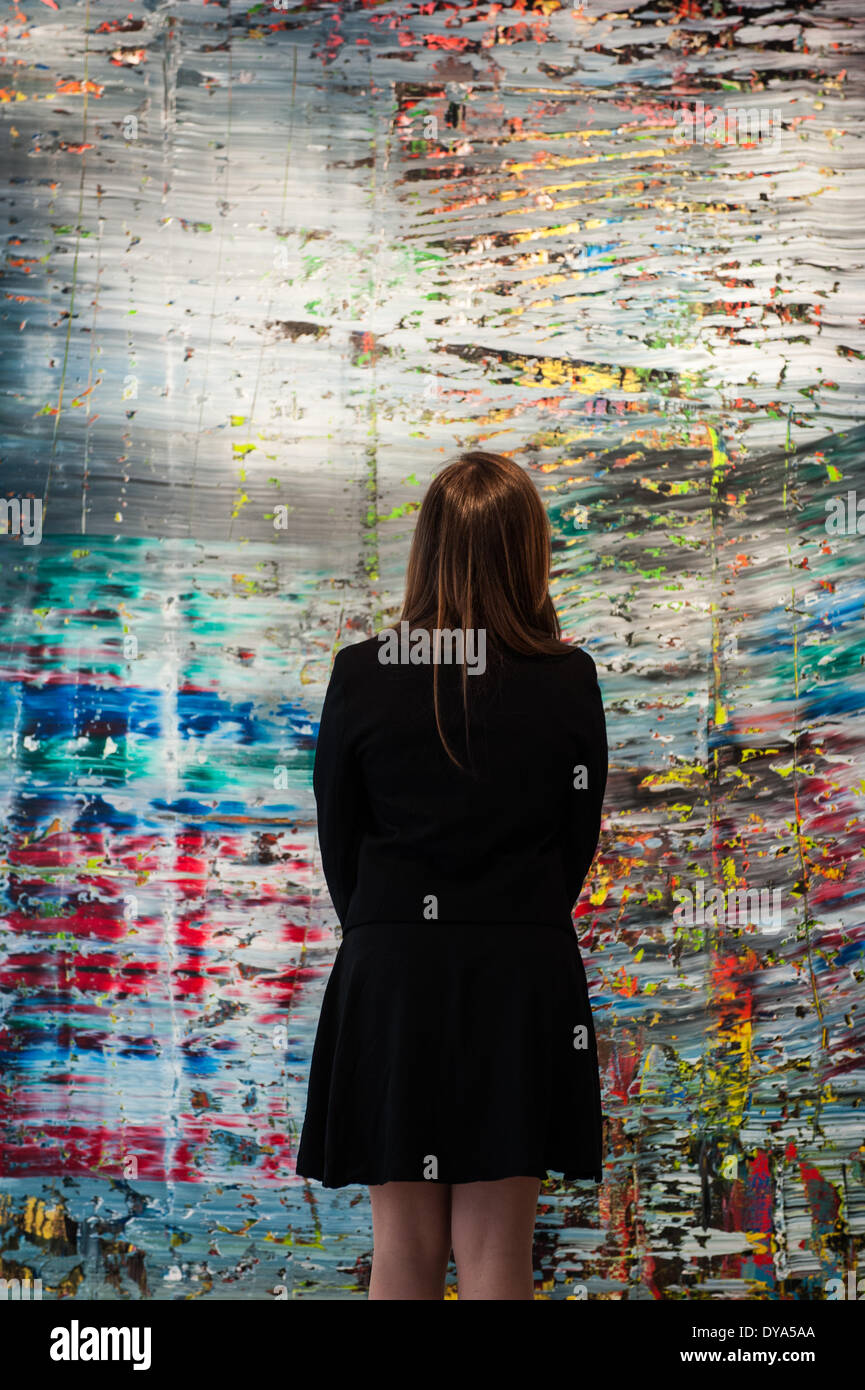 London, UK - 11 April 2014: a Christie’s employee looks at Abstraktes Bild (712), 1990 by Gerhard Richter during the preview of the Post-War and Contemporary Art evening sale that will take place in New York on the 13th May. Credit:  Piero Cruciatti/Alamy Live News Stock Photo