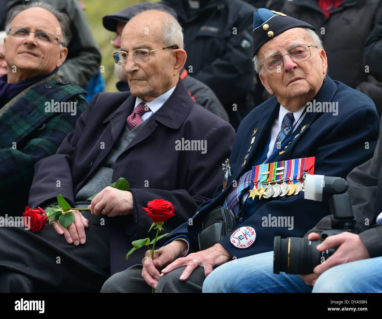 Nordhausen, Germany. 11th Apr, 2014. Bertrand Herz from France (L-R) and Ed Carter-Edwards from Canada sit in front of the crematorium during a commemoration event for the dead at concentration camp memorial site Mittelbau-Dora in Nordhausen, Germany, 11 April 2014. One the same day is the 69th anniversary of the liberation of the National Socialist camp. This year's commemoration event focuses on the genocide of the Hungarian Jews. Photo: Martin Schutt/dpa/Alamy Live News Stock Photo
