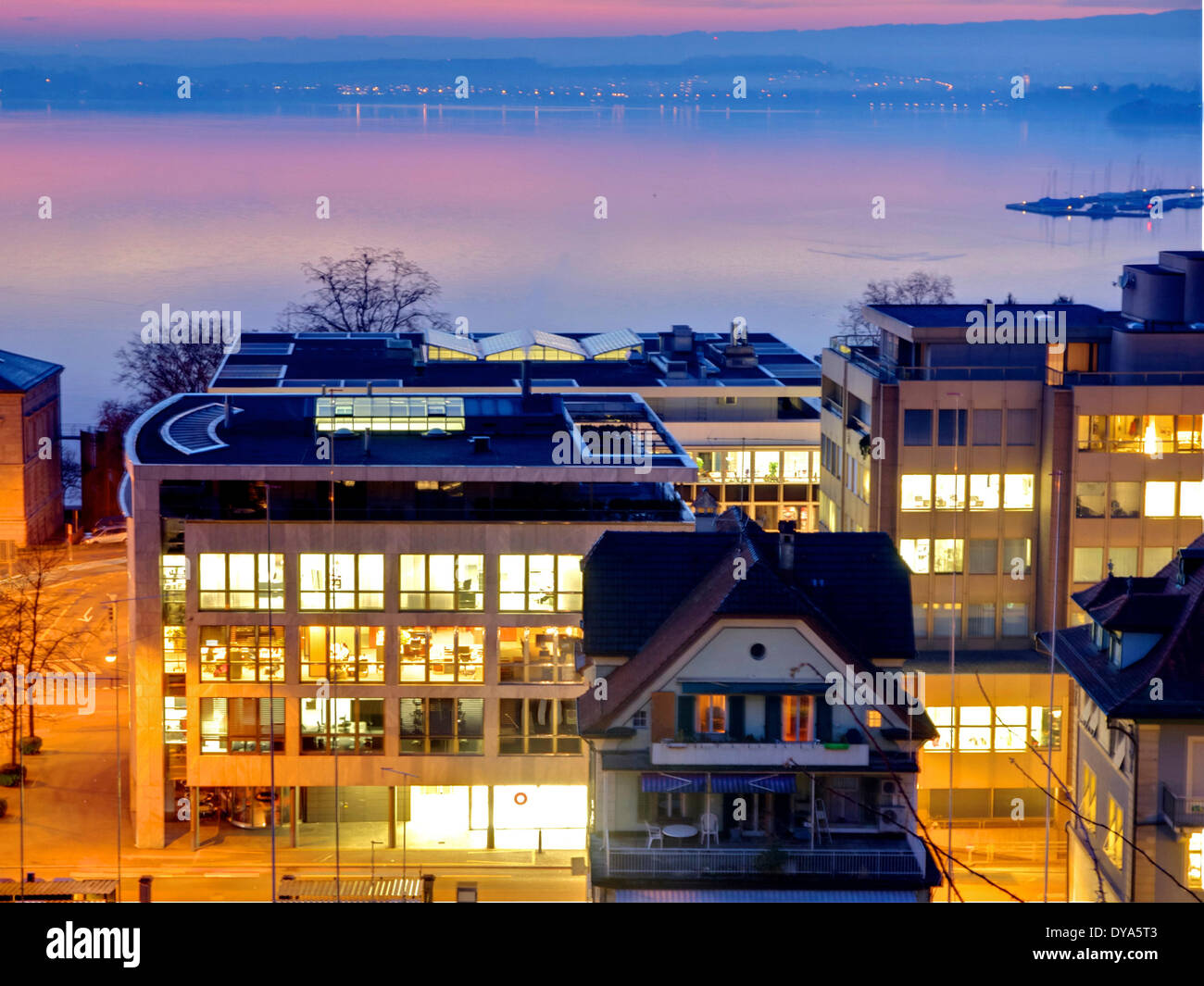 Switzerland, Europe, Zug, evening, lights, offices, windows, international, lake, lake of Zug Stock Photo