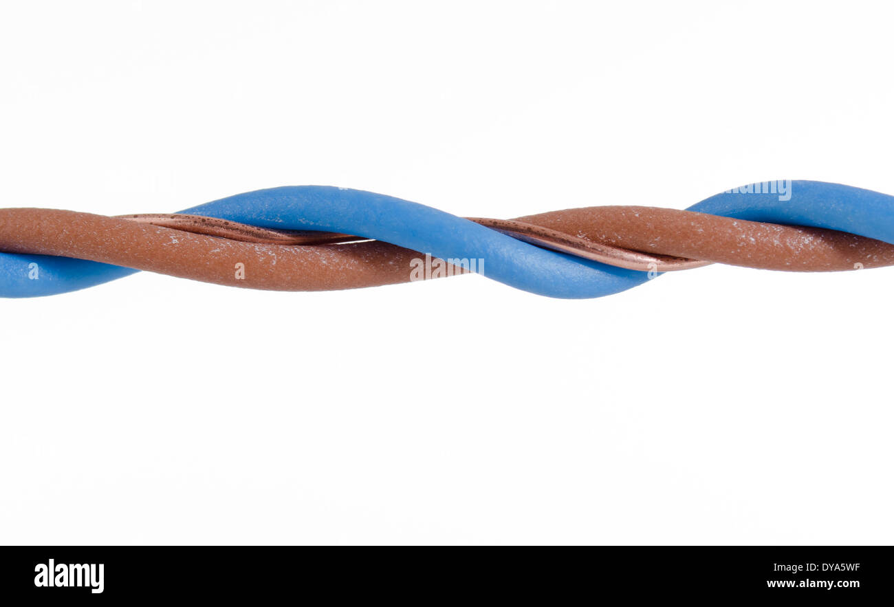 Close up of blue, brown cable and copper twisting on white backdrop ...