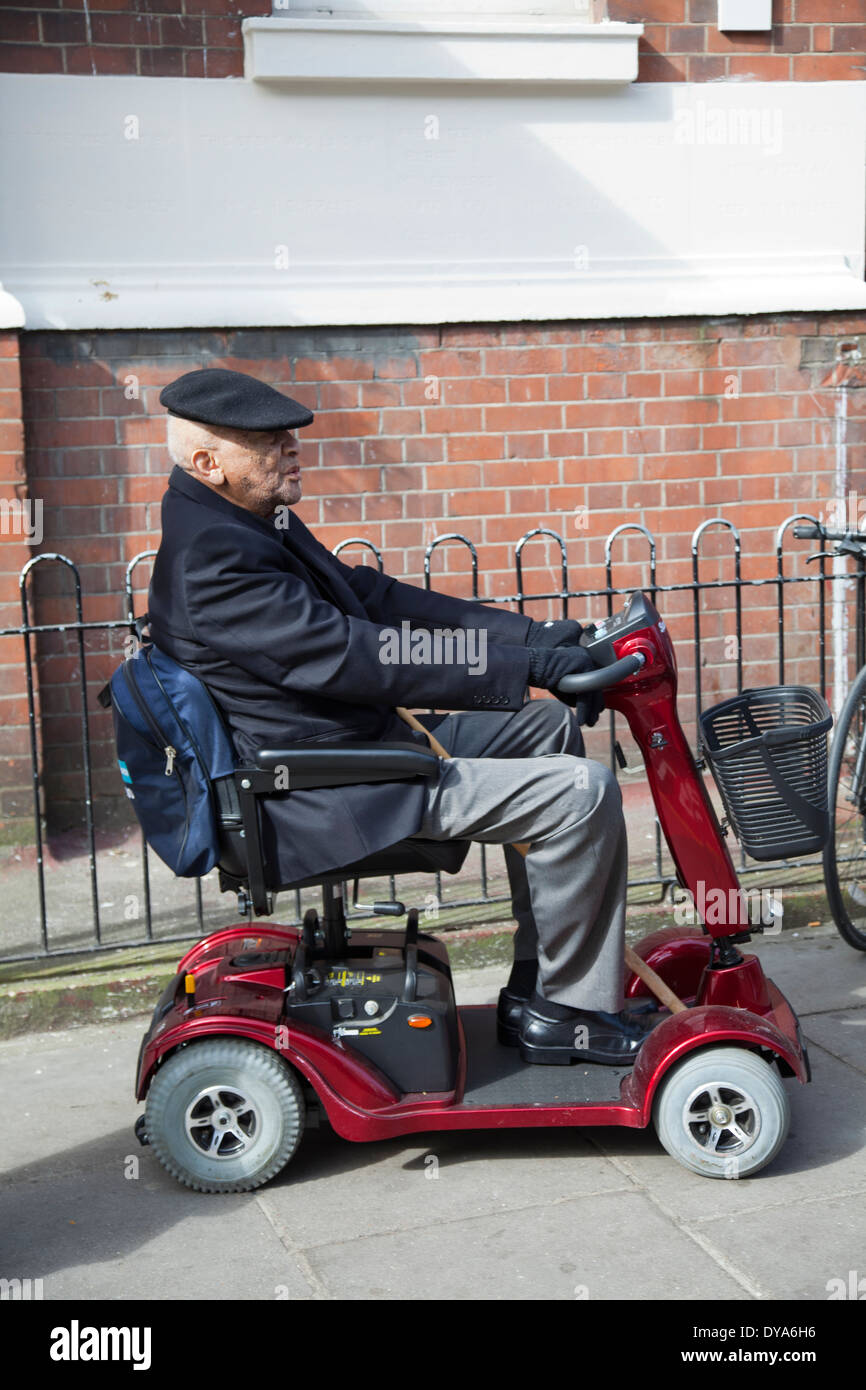 Old Man On Mobility Scooter Stock Photos & Old Man On Mobility Scooter