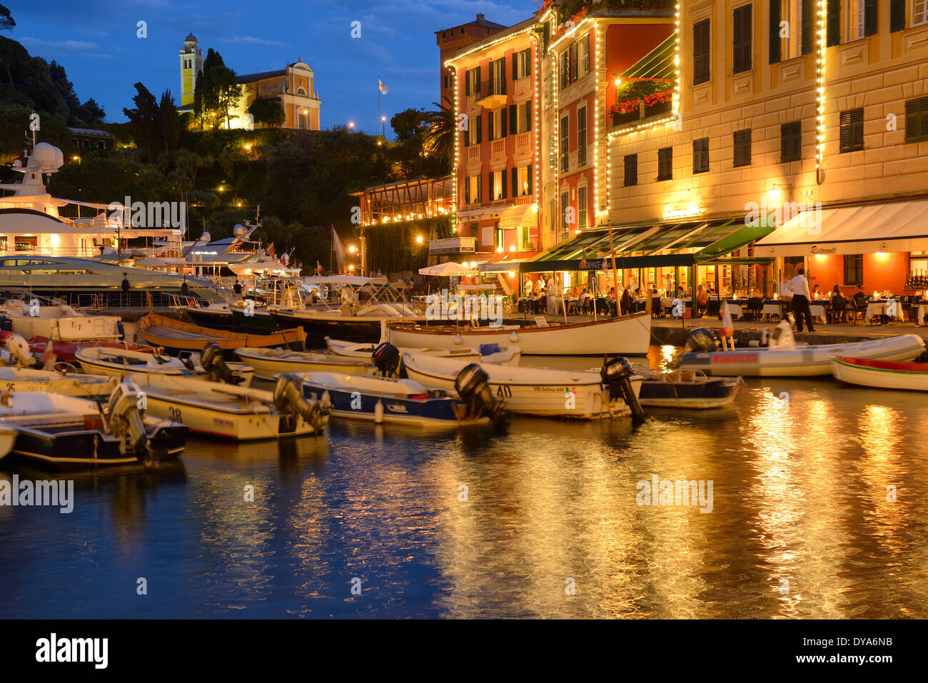Italy, Riviera, Genoa province, Portofino, Mediterranean, marina, dusk, lights, city Stock Photo