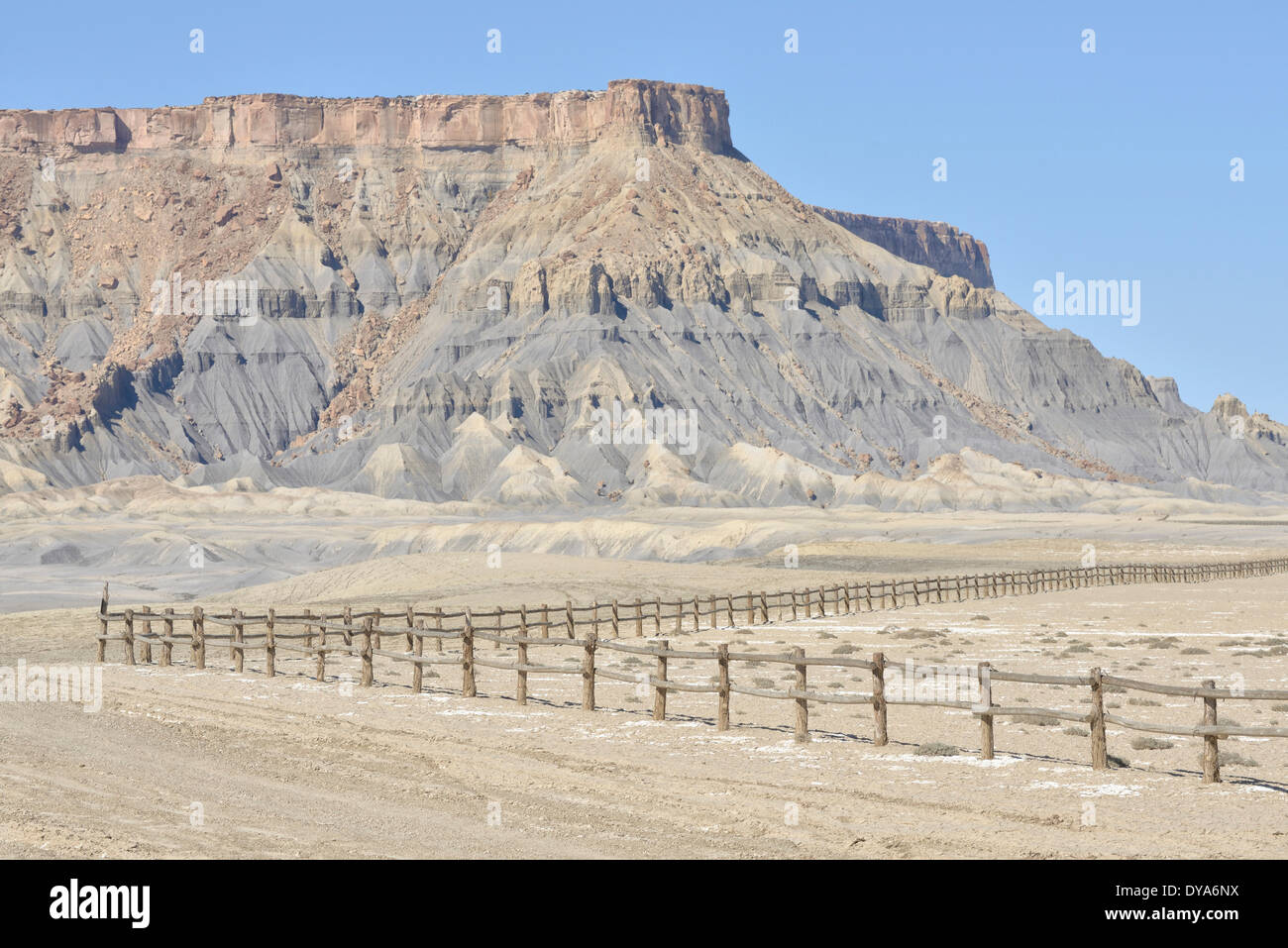 USA America United States Utah Colorado Plateau southern Factory Butte desert OTV area barren land rocks fence outback Stock Photo