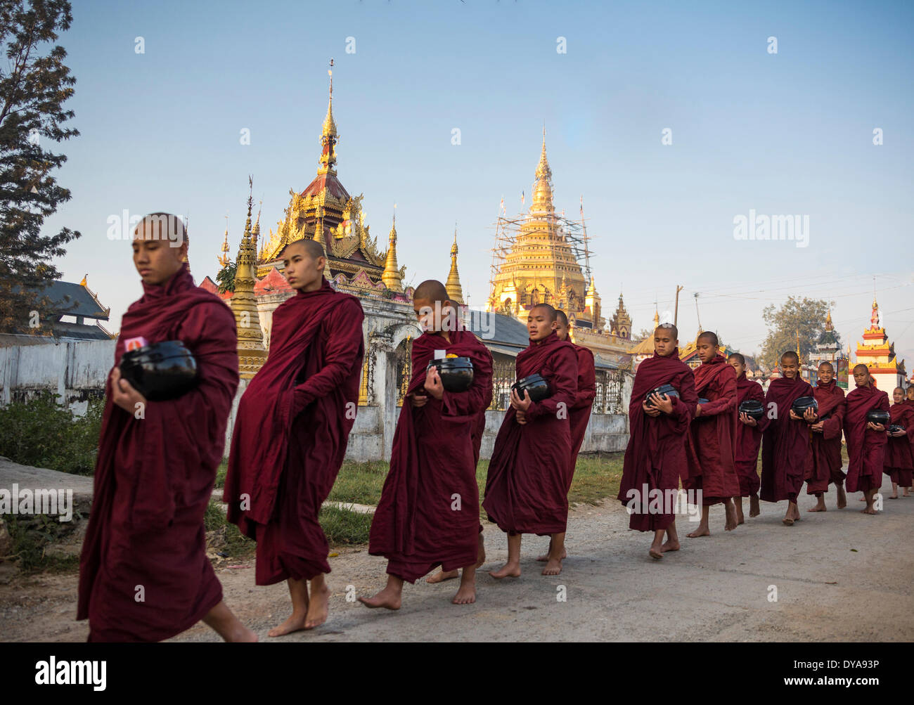 Nyaungshwe Myanmar Burma Asia architecture Buddhism colourful early lake monastery morning red monks religion temple touris Stock Photo