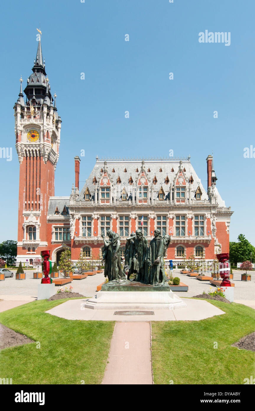 France, Calais. The six Burghers of Calais by Rodin stands in front of the Town Hall and belfry, designed by Louis Debrouwer. Stock Photo