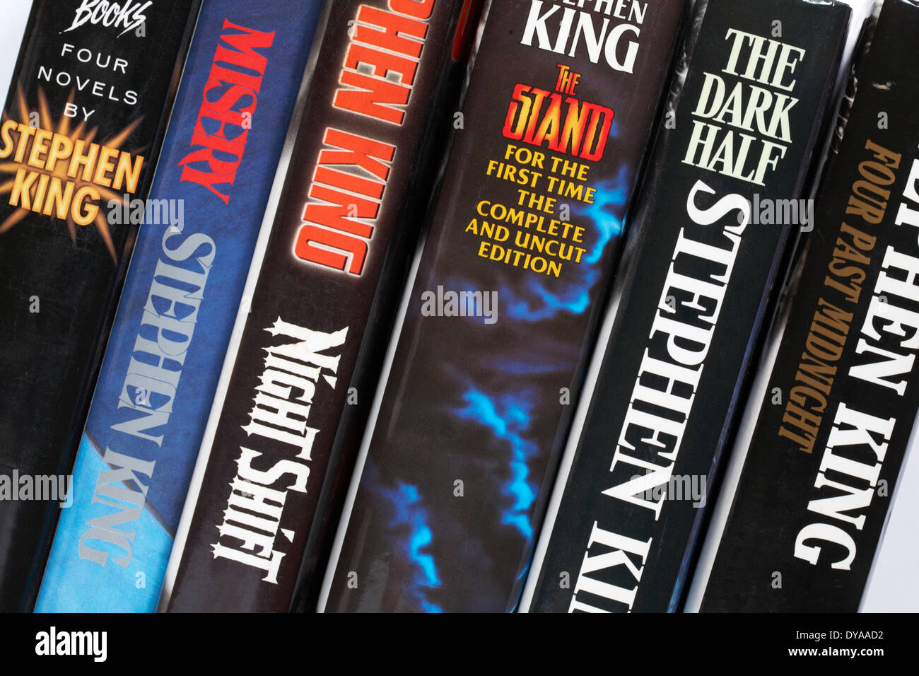 row of Stephen King books including Four Past Midnight, The Dark Half, the Stand, Night Shift, Misery and Four Novels by Stephen King Stock Photo