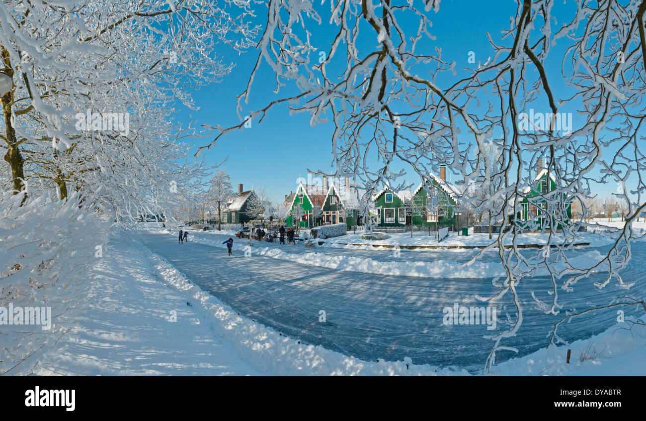 Netherlands Holland Europe Zaandam North Holland city village forest wood trees winter snow ice people frost scating skate Stock Photo