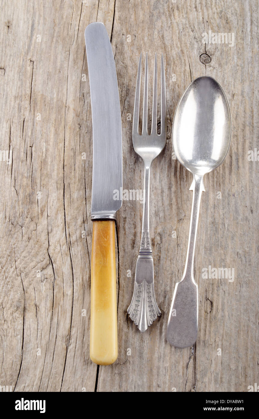 old fork, knife and spoon on rustic wood Stock Photo Alamy