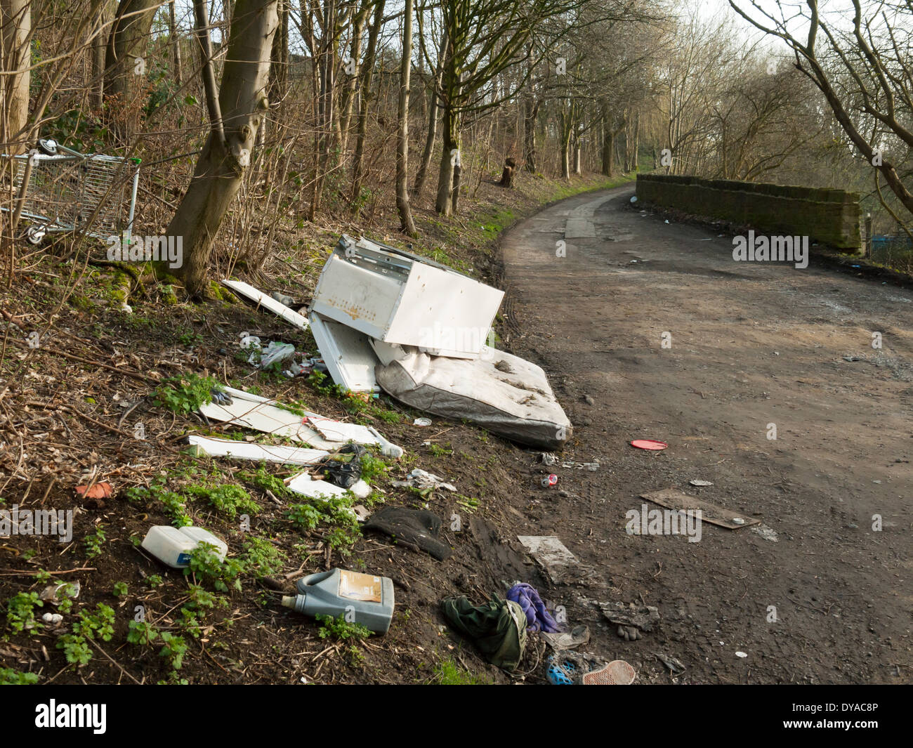 Rubbish dumped on a farm access road by the Peak Forest Canal, Dukinfield, Tameside, Manchester, England, UK Stock Photo