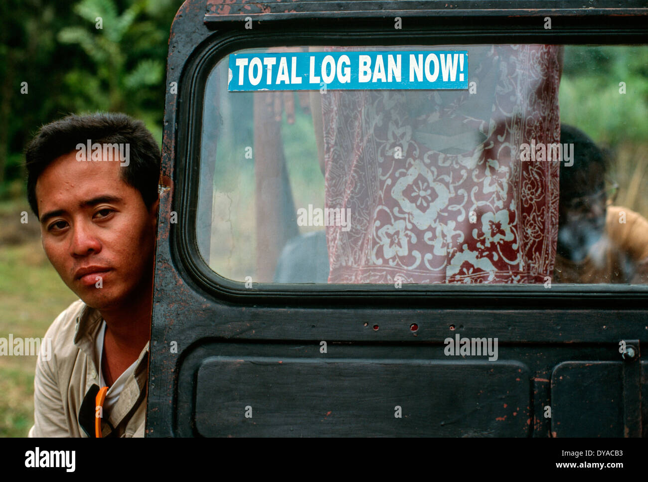 Phillippines man looking out truck car sticker TOTAL LOG BAN NOW lush ...
