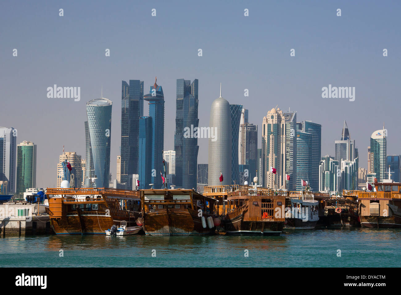 Doha Qatar Middle East architecture bay boats buildings city colourful futuristic harbour marina skyline skyscrapers tourist Stock Photo