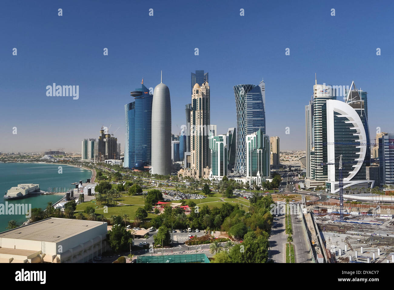 Burj Doha Qatar Middle East World Trade Center architecture bay city colourful corniche futuristic green panorama park prome Stock Photo